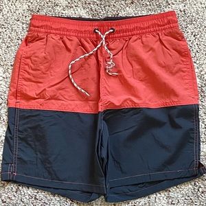 Men’s small lined swim trunks. Never worn. Navy and watermelon(?) color.